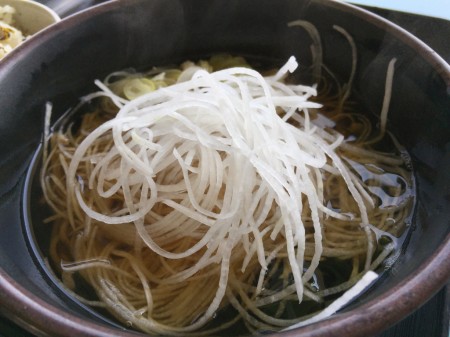 Soba topped with shredded radish