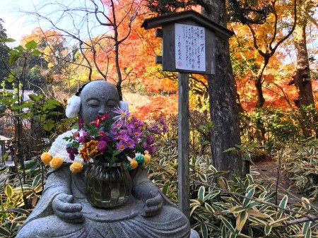 Autumn leaves and Jizo statue in Meigetsuin in Kamakura