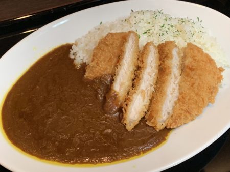 Curry and rice topped with pork cutlets by iPhone XS Max